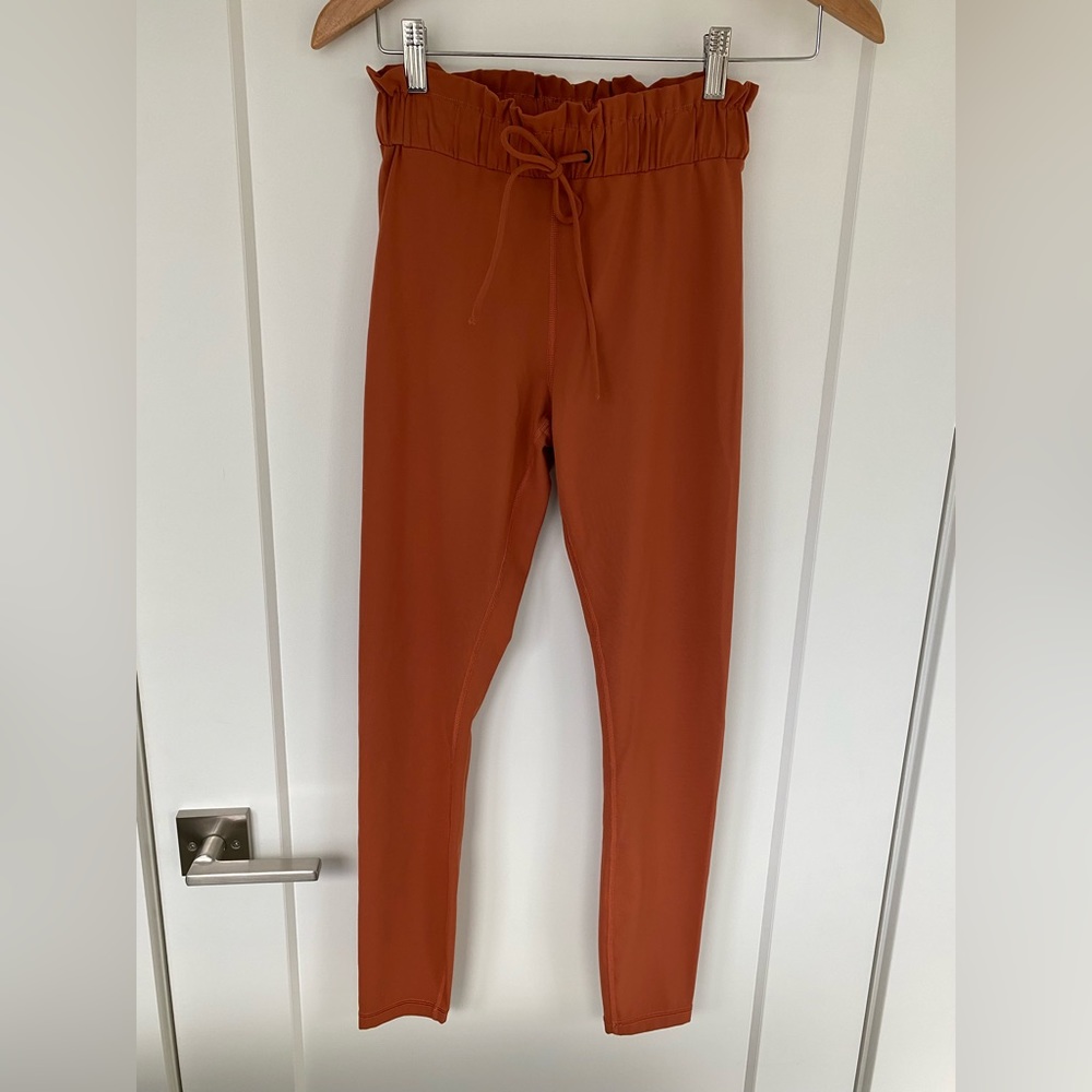 Titika Couture Athlectic tights. Rust colour size Small